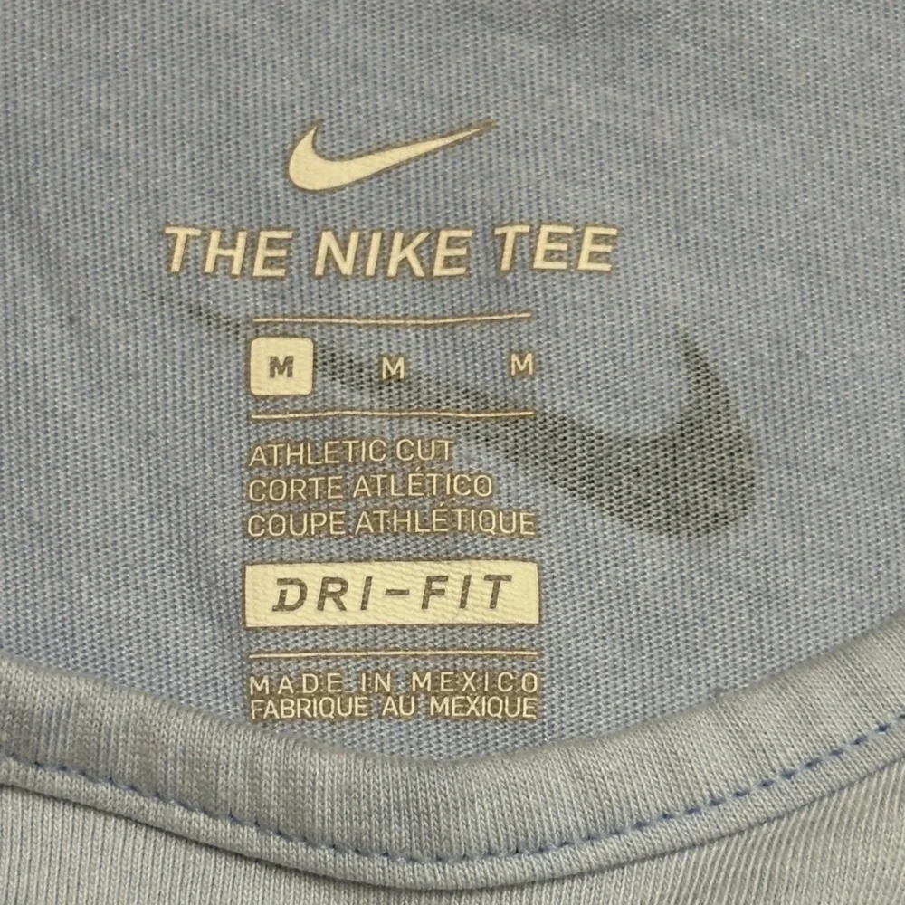 Nike light blue tank top with logo pattern. Size Medium.